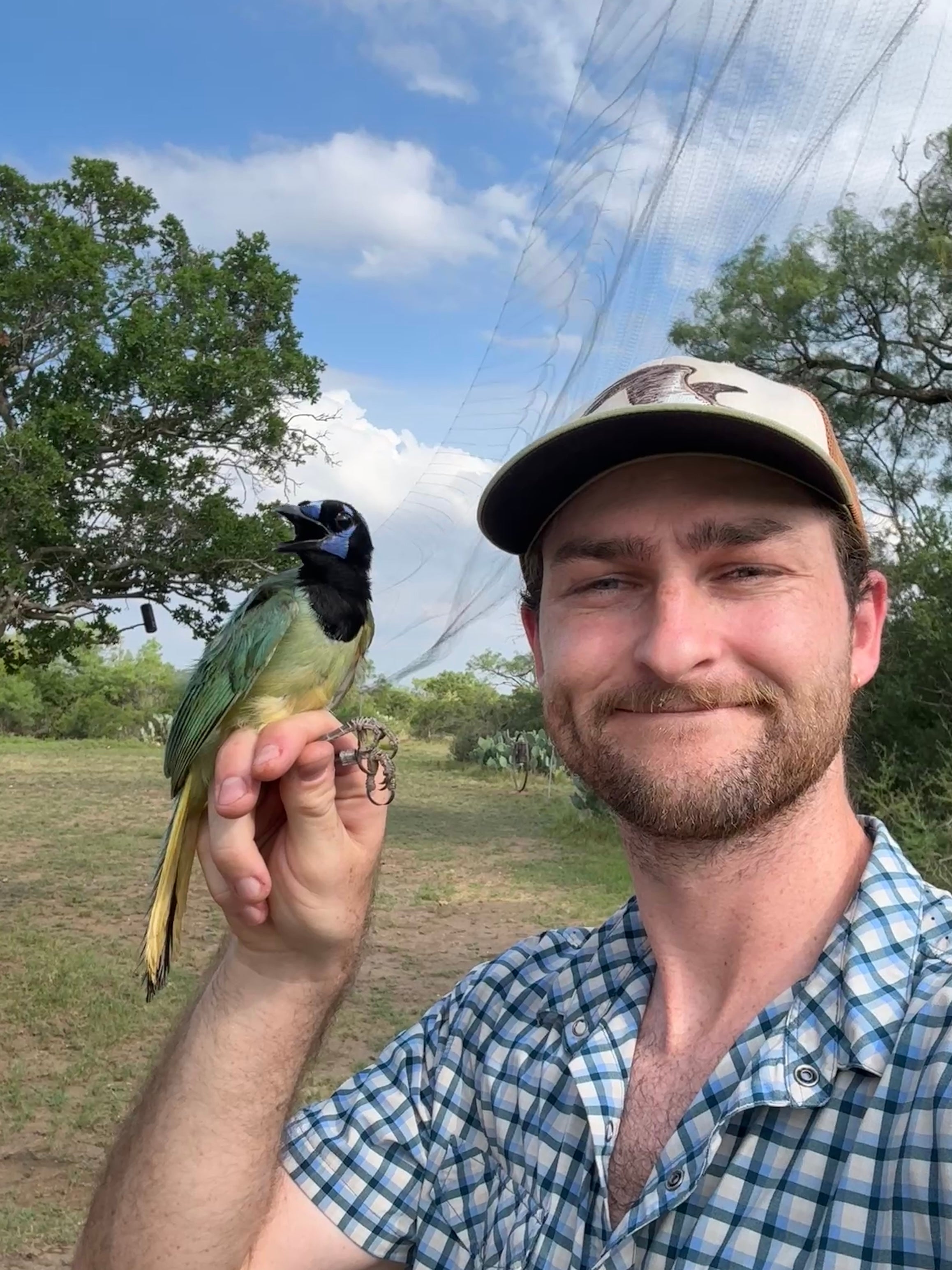 Brian posing with a green jay