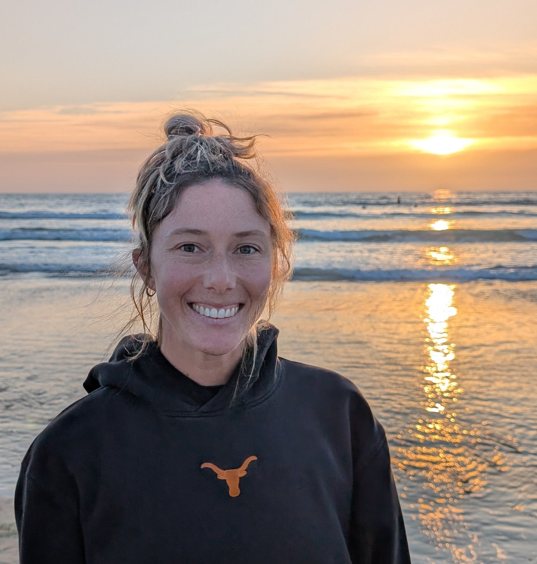 Juju in front of the beach during sunset